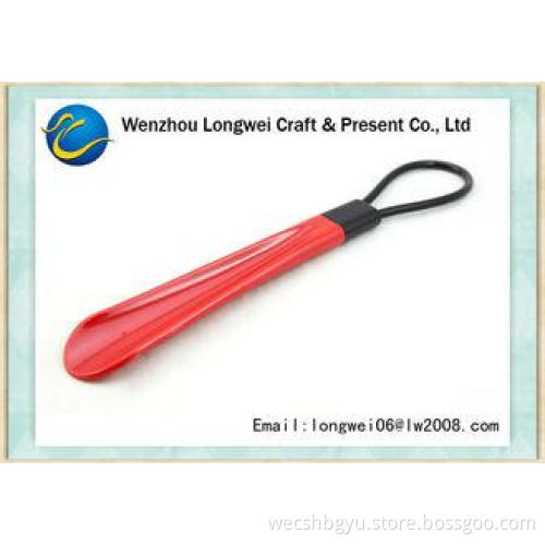 Medium size multicolor plastic shoe horn with convenient ha
